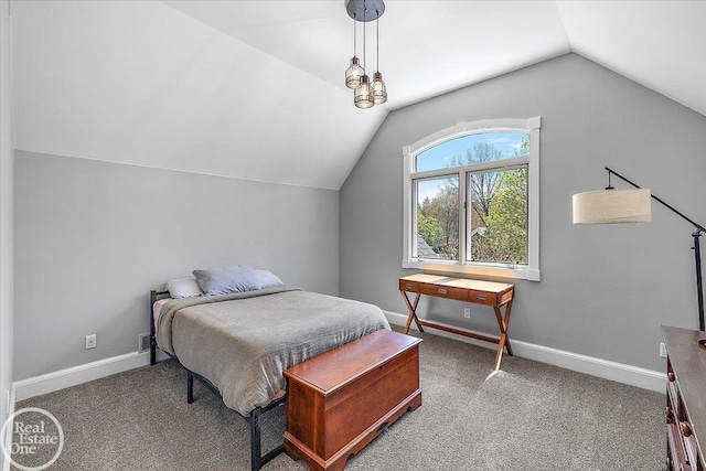 bedroom with carpet floors, baseboards, and vaulted ceiling