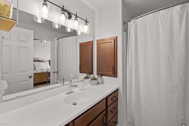 bathroom featuring vanity and ensuite bathroom