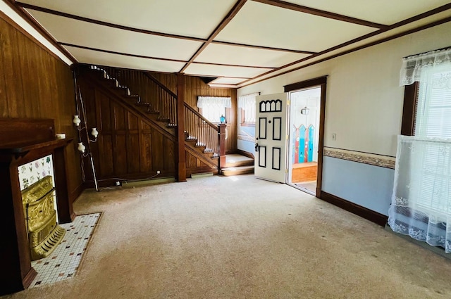 706 W Indiana St, Bay City, MI 48706 - unfurnished living room featuring stairway, baseboards, and carpet
