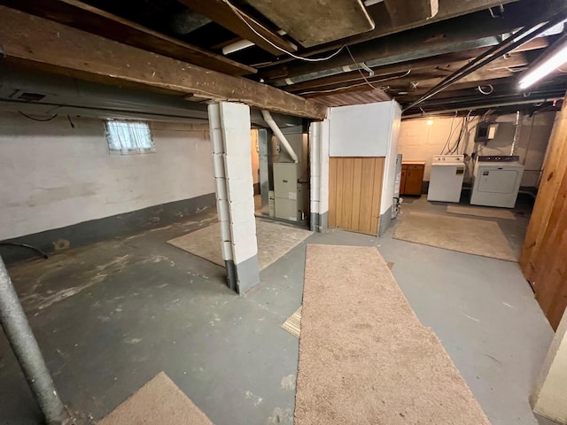 706 W Indiana St, Bay City, MI 48706 - below grade area featuring independent washer and dryer, heating unit, and electric panel
