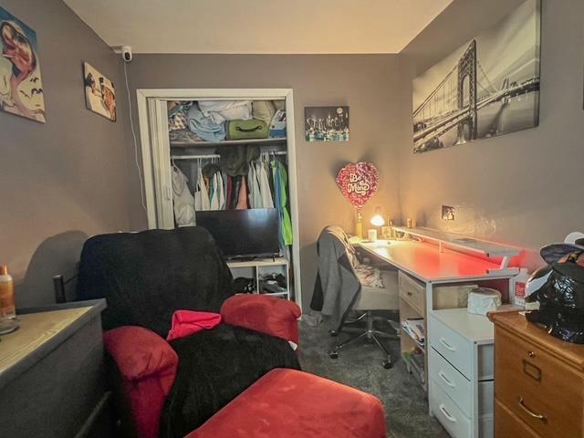 office area with dark carpet
