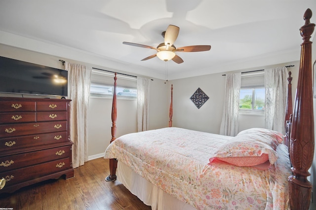 bedroom with baseboards, ceiling fan, and dark wood-style flooring