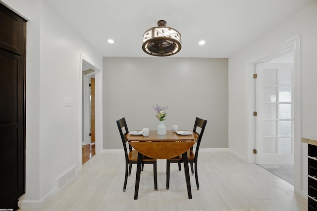 dining room featuring baseboards, recessed lighting, and visible vents
