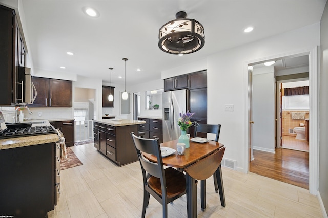 dining space featuring baseboards, plenty of natural light, recessed lighting, and visible vents