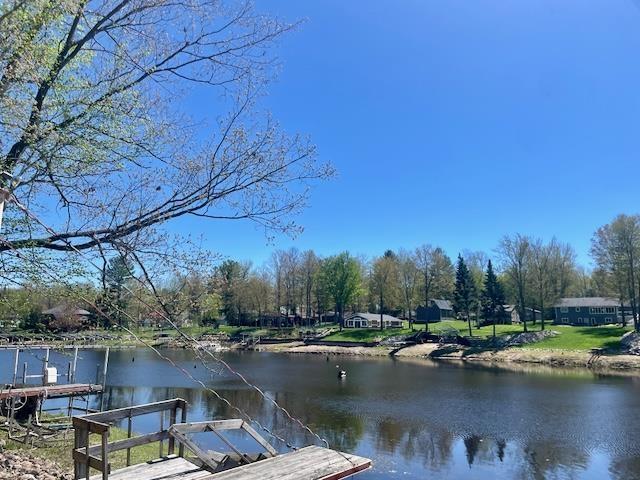 1548 Pioneer Rd, Alger, MI 48610 - view of dock featuring a water view