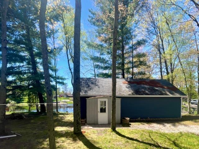 1548 Pioneer Rd, Alger, MI 48610 - view of outdoor structure featuring an outbuilding and a water view
