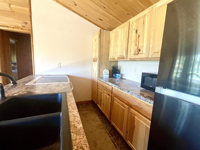 1548 Pioneer Rd, Alger, MI 48610 - kitchen featuring wood ceiling, black microwave, light brown cabinetry, a sink, and freestanding refrigerator