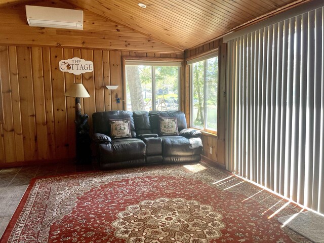 1548 Pioneer Rd, Alger, MI 48610 - living area featuring wooden walls, a wall mounted AC, vaulted ceiling, and a healthy amount of sunlight
