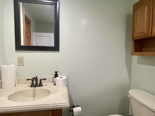 1548 Pioneer Rd, Alger, MI 48610 - half bathroom with vanity and toilet