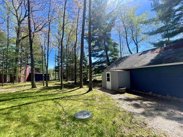 1548 Pioneer Rd, Alger, MI 48610 - view of yard with an outbuilding