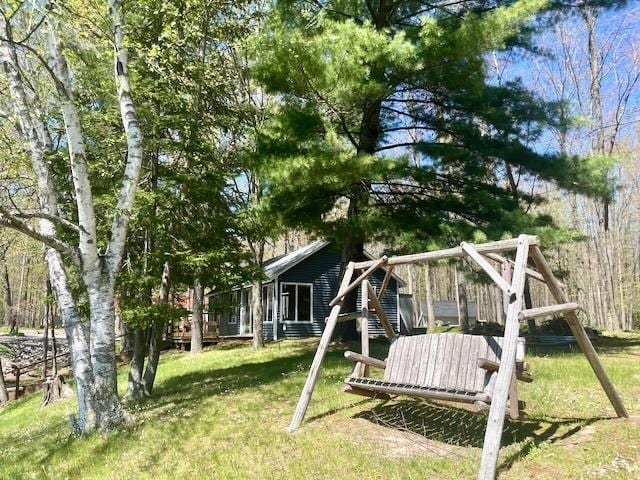 1548 Pioneer Rd, Alger, MI 48610 - view of yard featuring a wooden deck