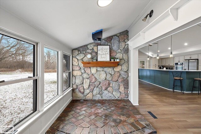 455 Garfield Rd, Fostoria, MI 48435 - interior space featuring a sink, vaulted ceiling, and visible vents