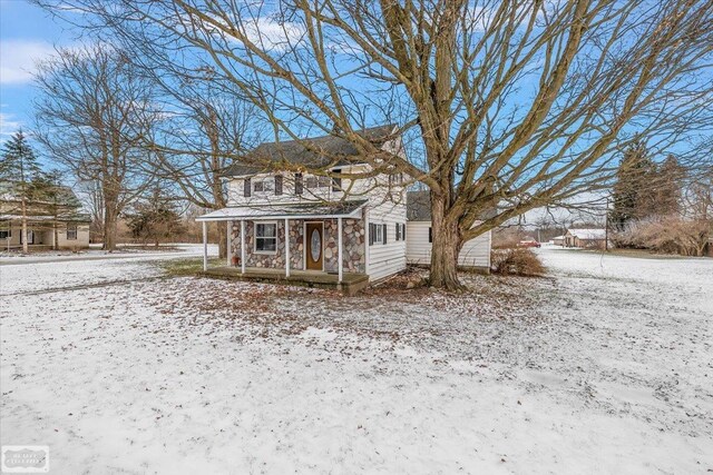 455 Garfield Rd, Fostoria, MI 48435 - snow covered structure featuring covered porch