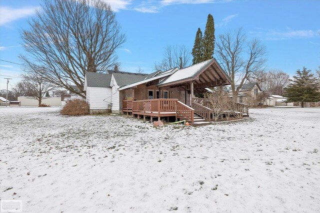 455 Garfield Rd, Fostoria, MI 48435 - snow covered property with a deck