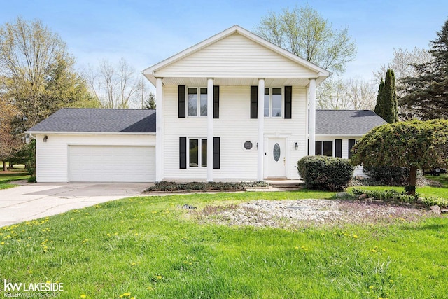 36870 Hebel Rd, Richmond Twp, MI 48062 - greek revival house with concrete driveway, a shingled roof, a front lawn, and a garage