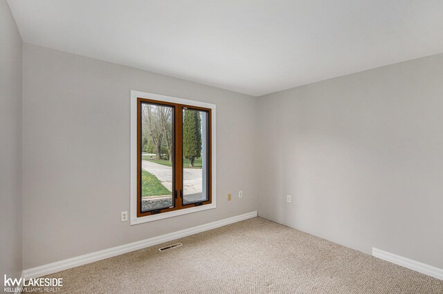 36870 Hebel Rd, Richmond Twp, MI 48062 - carpeted empty room with visible vents and baseboards