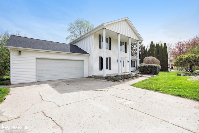 36870 Hebel Rd, Richmond Twp, MI 48062 - neoclassical / greek revival house featuring a garage, covered porch, driveway, and a front lawn