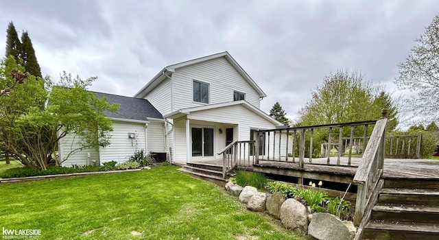 36870 Hebel Rd, Richmond Twp, MI 48062 - back of house featuring a lawn, a shingled roof, and a deck