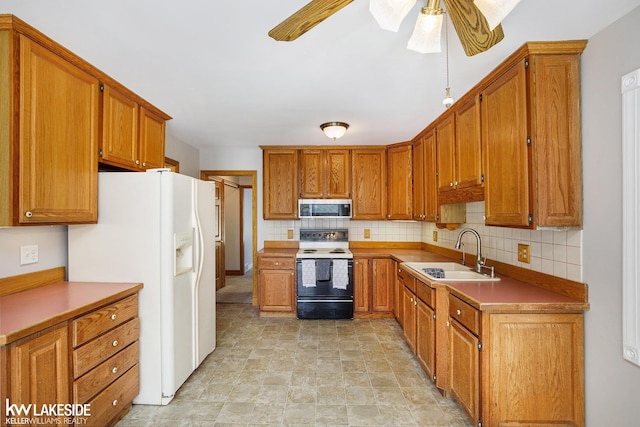 36870 Hebel Rd, Richmond Twp, MI 48062 - kitchen with ceiling fan, a sink, electric range oven, white fridge with ice dispenser, and stainless steel microwave