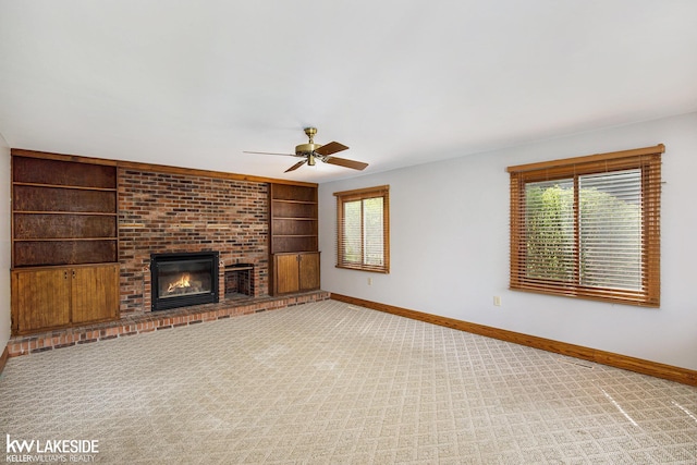 36870 Hebel Rd, Richmond Twp, MI 48062 - unfurnished living room with baseboards, carpet flooring, a ceiling fan, and built in shelves