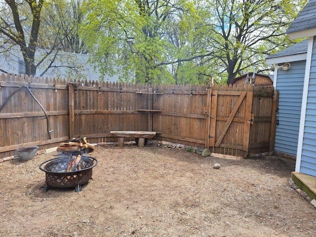 546 N Silverleaf St, Gladwin, MI 48624 - view of yard with an outdoor fire pit