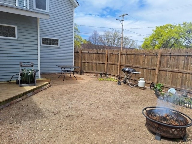 546 N Silverleaf St, Gladwin, MI 48624 - view of yard with a fire pit and a deck