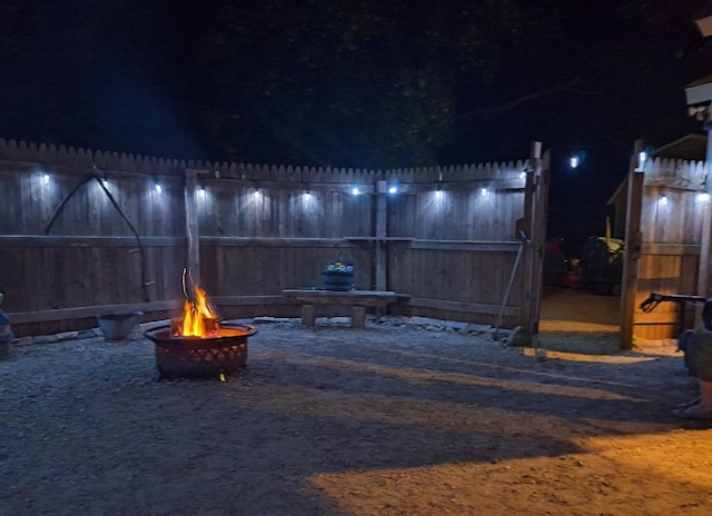 546 N Silverleaf St, Gladwin, MI 48624 - patio at twilight with a fire pit