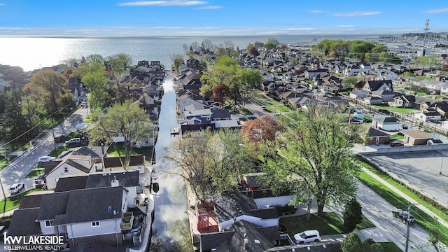aerial view featuring a residential view and a water view