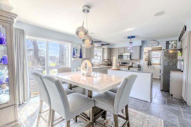 dining room featuring stone tile flooring