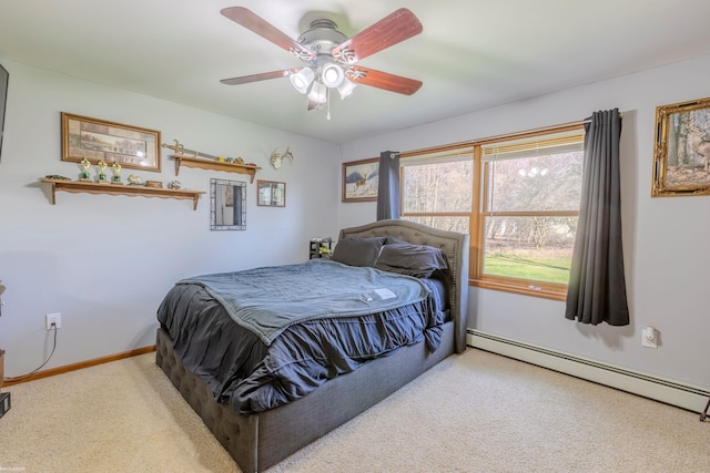 carpeted bedroom featuring baseboards, ceiling fan, and a baseboard heating unit