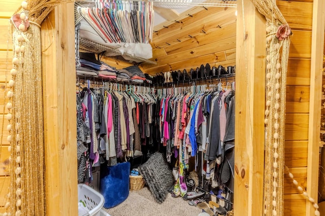 walk in closet featuring carpet flooring