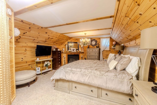 bedroom featuring wooden walls, carpet, vaulted ceiling, and a chandelier