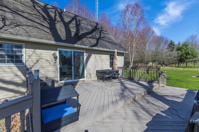 wooden terrace with a yard