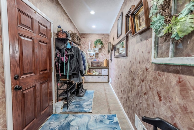 interior space with ornamental molding, recessed lighting, and visible vents