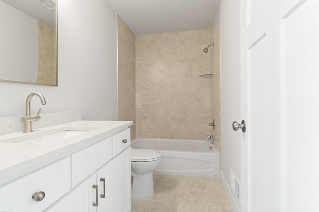 bathroom with vanity, bathtub / shower combination, and toilet