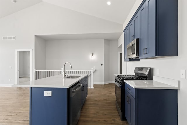 kitchen featuring a sink, blue cabinetry, stainless steel appliances, lofted ceiling, and visible vents