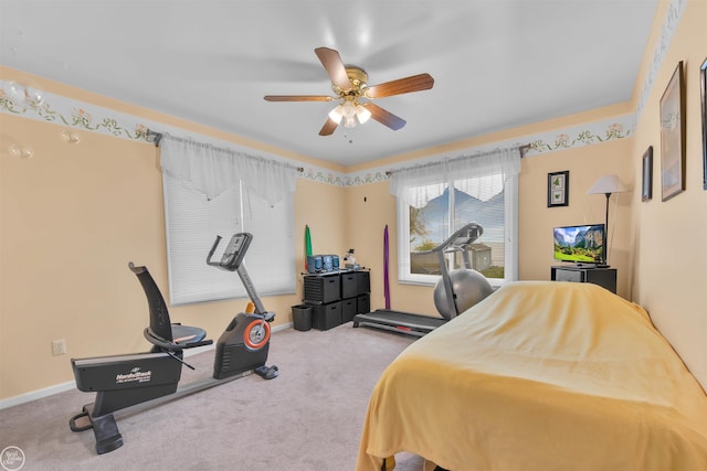 bedroom featuring baseboards, a ceiling fan, and carpet flooring