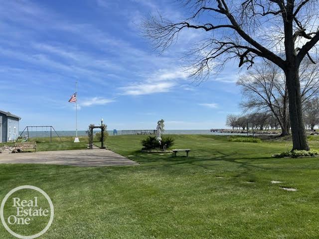 view of property's community with a lawn