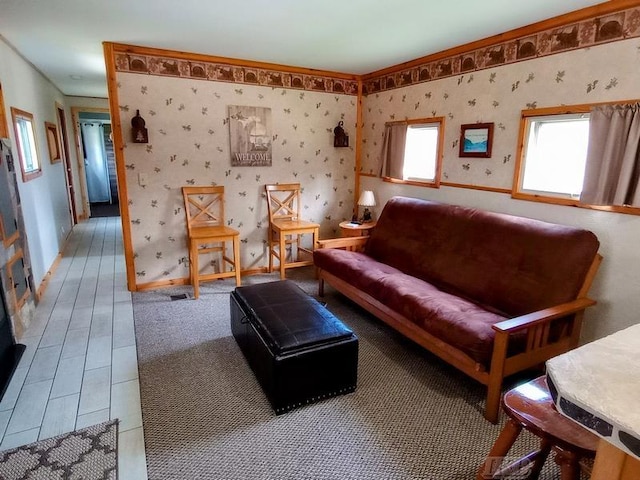 living area featuring baseboards