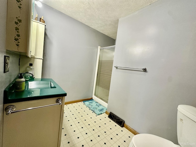 full bath featuring visible vents, a textured ceiling, toilet, and a shower stall