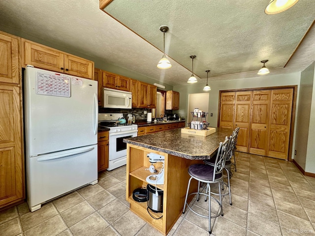 kitchen featuring a kitchen island, a textured ceiling, open shelves, a breakfast bar, and white appliances
