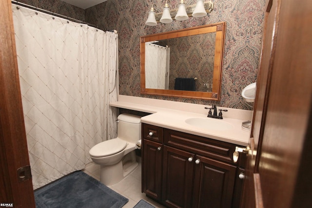 bathroom with vanity, toilet, a shower with shower curtain, wallpapered walls, and tile patterned floors