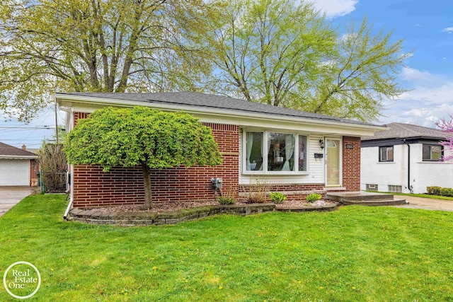 ranch-style home featuring brick siding, an outdoor structure, a front yard, and a garage