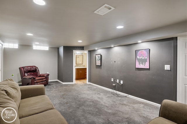 carpeted living room featuring recessed lighting, baseboards, and visible vents