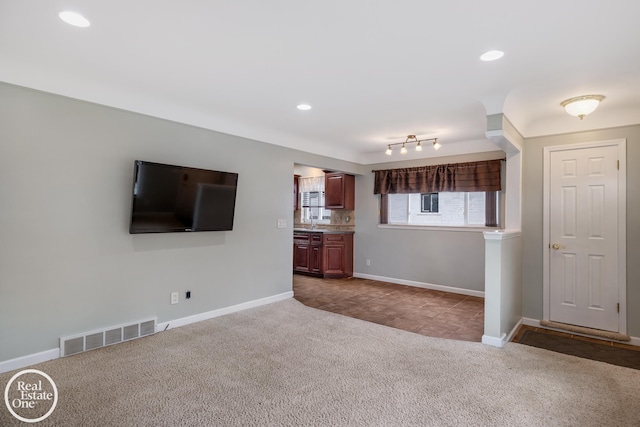 unfurnished living room with baseboards, carpet flooring, recessed lighting, and visible vents
