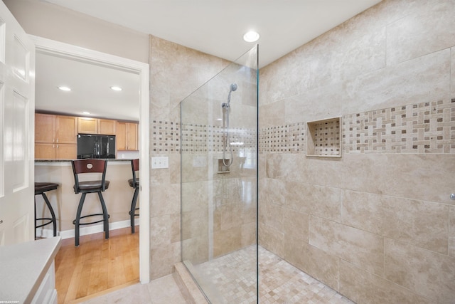 full bath featuring walk in shower, recessed lighting, and wood finished floors
