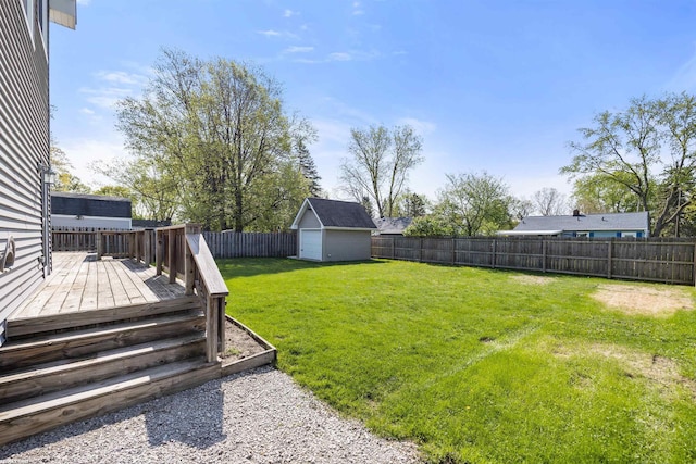 view of yard with an outdoor structure, a deck, a fenced backyard, and a storage unit