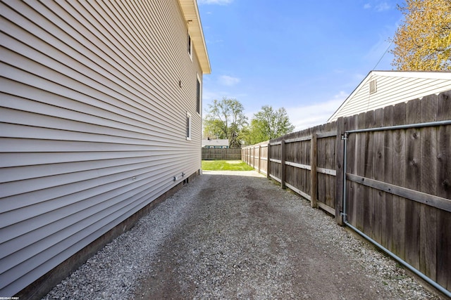 view of side of home with a fenced backyard