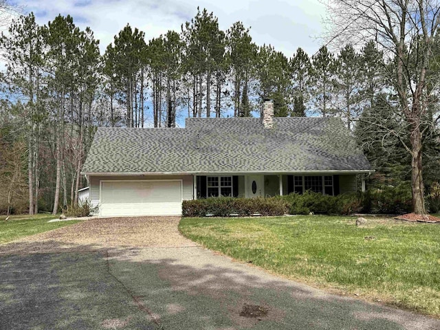 ranch-style home with concrete driveway, an attached garage, a chimney, and a front yard