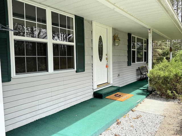 entrance to property featuring a porch